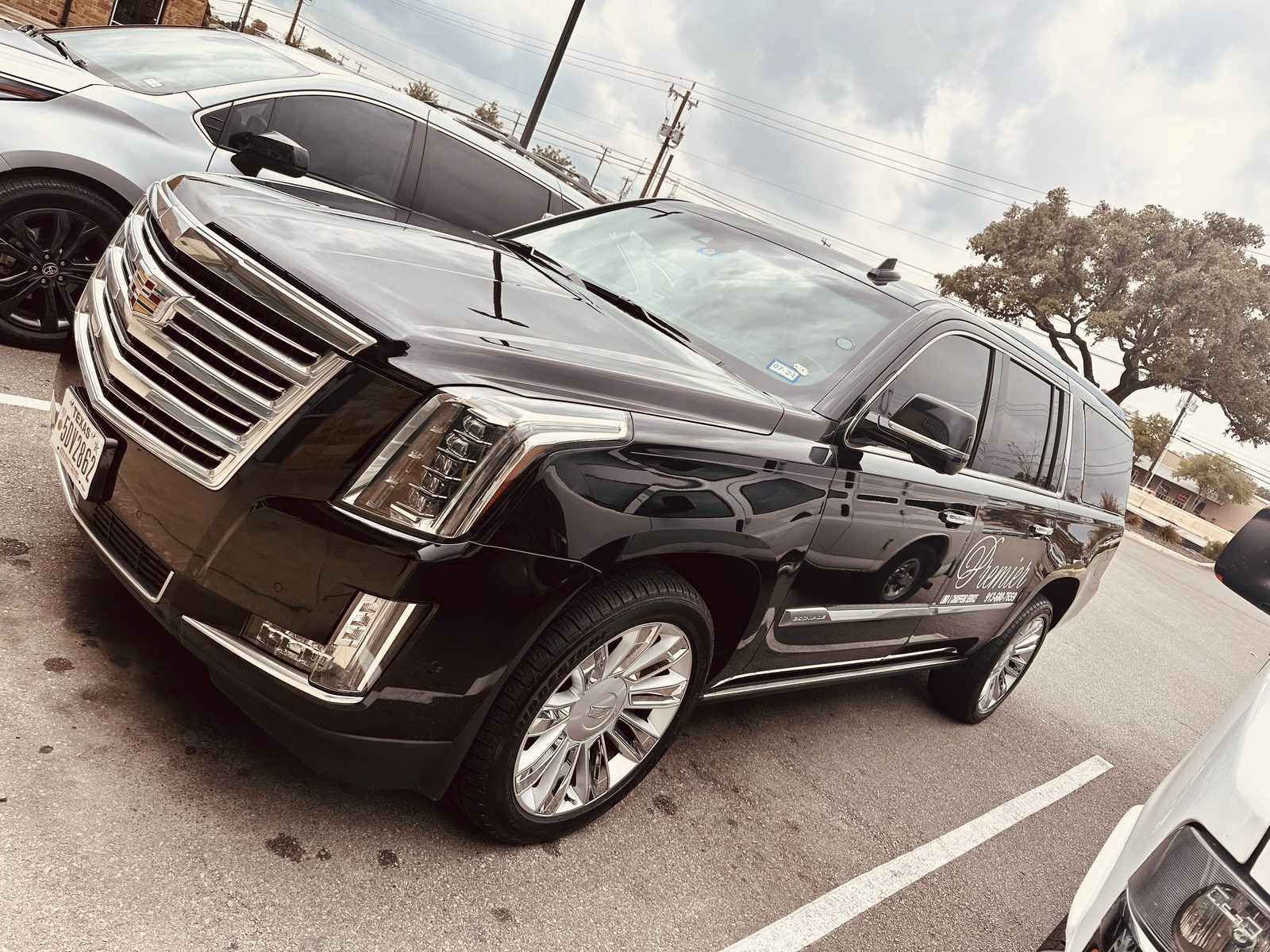 Premier Plus black Cadillac Escalade